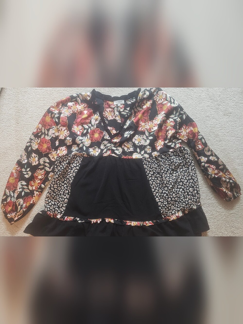 Umgee babydoll blouse features a bold, mixed design combining bohemian andanimal - Picture 7 of 10